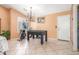 Well-lit dining area equipped with a treadmill and a foosball table at 3060 E Hope St, Mesa, AZ 85213