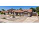 Charming single-Gathering home with well-maintained landscaping, a spacious driveway, and an inviting facade at 3060 E Hope St, Mesa, AZ 85213