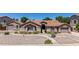 Charming single-story home featuring a well-maintained landscape and a spacious driveway at 3060 E Hope St, Mesa, AZ 85213