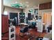 A customized entertainment room with unique wall decor, comfortable seating, and a well-lit space at 3060 E Hope St, Mesa, AZ 85213