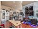 This room features sleek hardwood floors, a desk area, and wall-mounted decor, perfect for entertainment at 3060 E Hope St, Mesa, AZ 85213