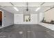 Spacious garage featuring ample storage cabinets and a clean, organized layout, perfect for a workshop or parking at 3060 E Hope St, Mesa, AZ 85213