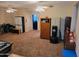Large room with carpet flooring and ceiling fans offers potential for versatile use at 3060 E Hope St, Mesa, AZ 85213