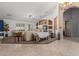 Bright living room with neutral colors, built-in shelving, and plush seating at 3060 E Hope St, Mesa, AZ 85213