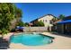 The sparkling pool, with its inviting turquoise water, features a built-in spa and a serene outdoor ambiance at 3060 E Hope St, Mesa, AZ 85213