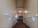 An upward view of a wood staircase with white handrail and light-colored walls at 3060 E Hope St, Mesa, AZ 85213