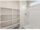 Shower stall with built-in shelves and window at 35266 W San Sisto Ave, Maricopa, AZ 85138