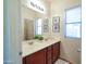 Well-lit bathroom with a dual sink vanity and modern fixtures at 35721 N Zachary Rd, Queen Creek, AZ 85144