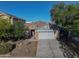 Charming single-story home featuring stone accents, two-car garage and well-manicured front yard at 35721 N Zachary Rd, Queen Creek, AZ 85144