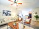 Bright living room featuring comfortable furniture, a ceiling fan, and neutral decor at 35721 N Zachary Rd, Queen Creek, AZ 85144