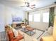 Open-concept living room with a comfortable seating arrangement, perfect for relaxation and entertaining at 35721 N Zachary Rd, Queen Creek, AZ 85144