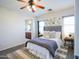 Serene primary bedroom featuring a comfortable bed, elegant decor, and ample natural light at 35721 N Zachary Rd, Queen Creek, AZ 85144