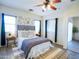Serene main bedroom with a ceiling fan, natural light, and modern decor at 35721 N Zachary Rd, Queen Creek, AZ 85144