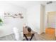 Bright home office featuring a contemporary desk, decor and closet for storing office supplies at 35721 N Zachary Rd, Queen Creek, AZ 85144