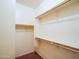 Bright walk-in closet features multiple shelves, rods, and ample storage space at 35721 N Zachary Rd, Queen Creek, AZ 85144