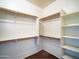 Spacious walk-in closet featuring ample shelving and rods for storage at 35721 N Zachary Rd, Queen Creek, AZ 85144
