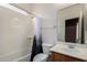 Bathroom with a shower-tub combination, toilet, and vanity with wood cabinets and a large mirror at 36114 W Vera Cruz Dr, Maricopa, AZ 85138