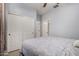Light-filled bedroom with ensuite bath and large closets, perfect for relaxation at 36114 W Vera Cruz Dr, Maricopa, AZ 85138