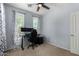 Bright bedroom with dual windows, neutral walls, and carpeted floor, perfect for work or rest at 36114 W Vera Cruz Dr, Maricopa, AZ 85138