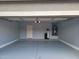 Spacious garage with epoxy floors, room for two cars and extra storage at 36114 W Vera Cruz Dr, Maricopa, AZ 85138
