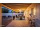 Charming backyard patio with covered area, stylish furniture, and a cozy fire pit for outdoor enjoyment at 3624 E Hearn Rd, Phoenix, AZ 85032