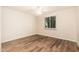 Inviting bedroom with wood floors and a window offering outdoor views at 3624 E Hearn Rd, Phoenix, AZ 85032