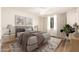 Stylishly decorated bedroom with a comfortable bed, modern art, and soft lighting at 3624 E Hearn Rd, Phoenix, AZ 85032