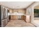 Well-lit kitchen features stainless steel appliances, light wood cabinetry, and wood-look floors at 3624 E Hearn Rd, Phoenix, AZ 85032