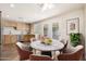A kitchen and dining nook with stainless appliances, wooden cabinets, and a marble table set at 3624 E Hearn Rd, Phoenix, AZ 85032