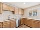 Bright kitchen featuring stainless steel appliances, wood cabinets, and plenty of counter space at 3624 E Hearn Rd, Phoenix, AZ 85032