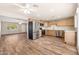 Spacious kitchen with stainless steel appliances, wooden cabinetry, and wood-look flooring at 3624 E Hearn Rd, Phoenix, AZ 85032