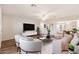 Stylishly staged living room with modern furnishings, neutral tones, and wood-look flooring at 3624 E Hearn Rd, Phoenix, AZ 85032