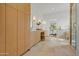 Bright bathroom with dual vanities, tower storage, and glass enclosed shower at 4107 E Edgemont Ave, Phoenix, AZ 85008