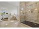 Bright bathroom features a glass shower and a modern soaking tub at 4107 E Edgemont Ave, Phoenix, AZ 85008