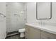 Stylish bathroom featuring a glass-enclosed shower, sleek vanity, and contemporary finishes at 4107 E Edgemont Ave, Phoenix, AZ 85008