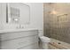 Modern bathroom boasts a stylish vanity, sleek fixtures, and a glass-enclosed shower at 4107 E Edgemont Ave, Phoenix, AZ 85008
