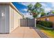 Concrete driveway leading to a gated entrance, showcasing modern design and clean lines at 4107 E Edgemont Ave, Phoenix, AZ 85008