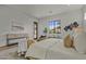 Light-filled bedroom featuring a comfortable bed, backyard views and sophisticated decor at 4107 E Edgemont Ave, Phoenix, AZ 85008
