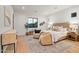 Bright main bedroom features modern decor, a cozy seating area, and a large window for natural light at 4107 E Edgemont Ave, Phoenix, AZ 85008