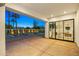 Spacious patio leading to a pool, with a view of the house through large glass doors at 4107 E Edgemont Ave, Phoenix, AZ 85008