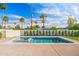 Inviting pool with blue tile accents, complemented by a well-maintained yard and palm trees at 4107 E Edgemont Ave, Phoenix, AZ 85008