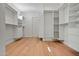 Spacious walk-in closet features custom shelving and hardwood floors at 4107 E Edgemont Ave, Phoenix, AZ 85008