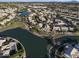 Aerial view showcases homes with backyard pools and a beautiful lakefront community at 418 W Sagebrush St, Gilbert, AZ 85233