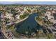 Scenic aerial view of a lakeside community featuring well-maintained homes and lush landscaping at 418 W Sagebrush St, Gilbert, AZ 85233