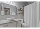 Well-lit bathroom with a modern sink, granite countertop, and a large mirror, showcasing contemporary design at 418 W Sagebrush St, Gilbert, AZ 85233
