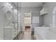 Bathroom with a soaking tub, double sinks, and a shower stall, offering a luxurious and functional space at 418 W Sagebrush St, Gilbert, AZ 85233