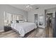 Spacious bedroom features vaulted ceilings, a ceiling fan, an en-suite bath, and wood-look floors at 418 W Sagebrush St, Gilbert, AZ 85233