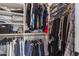Organized walk-in closet with shelving and hanging rods, offering ample storage space at 418 W Sagebrush St, Gilbert, AZ 85233