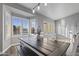Bright dining area with a farmhouse table, shuttered windows, and modern lighting at 418 W Sagebrush St, Gilbert, AZ 85233
