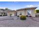 Inviting single-story home with decorative rock landscaping, mature plants, and an attached garage at 418 W Sagebrush St, Gilbert, AZ 85233